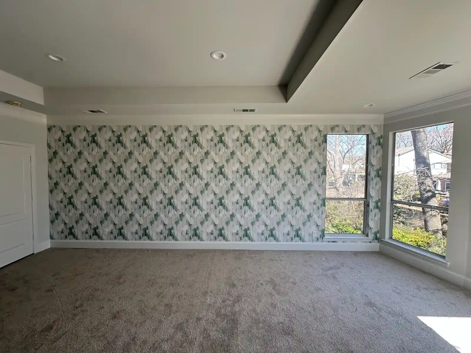 Diamond pattern wallpaper on a bright interior wall